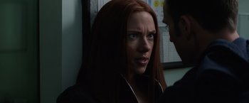 Movie still from “Captain America: The Winter Soldier” (2014), directed by Anthony Russo – A person with long red hair; Close Up shot, Over the shoulder angle