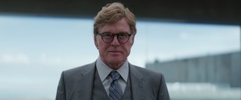 Movie still from “Captain America: The Winter Soldier” (2014), directed by Anthony Russo – A person wearing a suit and tie; Close Up shot, Low angle