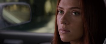Movie still from “Captain America: The Winter Soldier” (2014), directed by Anthony Russo – A person with long red hair; Close Up shot, Over the shoulder angle