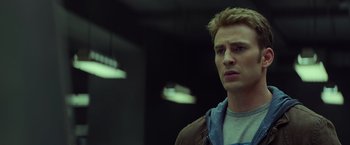 Movie still from “Captain America: The Winter Soldier” (2014), directed by Anthony Russo – A young man in a brown jacket looking to his left; Close Up shot, Low angle