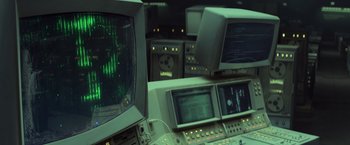 Movie still from “Captain America: The Winter Soldier” (2014), directed by Anthony Russo – Many monitors in this room and there is a green light on them; Medium shot, High angle