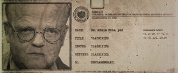 Movie still from “Captain America: The Winter Soldier” (2014), directed by Anthony Russo – An old photo of a man with glasses and a mustache; Extreme Close Up shot, Over the shoulder angle