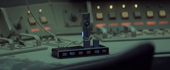 Movie still from “Captain America: The Winter Soldier” (2014), directed by Anthony Russo – A docking station with multiple usb ports; Extreme Close Up shot, High angle