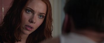 Movie still from “Captain America: The Winter Soldier” (2014), directed by Anthony Russo – A person with long red hair; Close Up shot, Over the shoulder angle