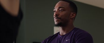 Movie still from “Captain America: The Winter Soldier” (2014), directed by Anthony Russo – A person wearing a purple shirt; Close Up shot, Over the shoulder angle