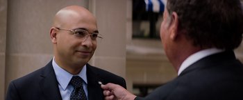 Movie still from “Captain America: The Winter Soldier” (2014), directed by Anthony Russo – A man in a suit and tie fixing another man's tie; Close Up shot, Over the shoulder angle