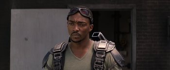 Movie still from “Captain America: The Winter Soldier” (2014), directed by Anthony Russo – A man wearing goggles and a harness; Close Up shot, Over the shoulder angle