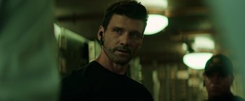 Movie still from “Captain America: The Winter Soldier” (2014), directed by Anthony Russo – A person wearing a headset; Close Up shot, Over the shoulder angle