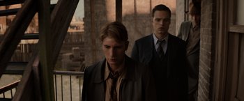 Movie still from “Captain America: The Winter Soldier” (2014), directed by Anthony Russo – A man in a suit and tie standing next to another man in a suit and tie; Close Up shot, Low angle
