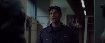 Movie still from “Captain America: The Winter Soldier” (2014), directed by Anthony Russo – A man wearing a uniform and a hat; Close Up shot, Over the shoulder angle