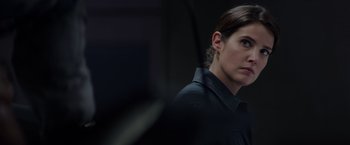 Movie still from “Captain America: The Winter Soldier” (2014), directed by Anthony Russo – A person wearing a black uniform; Close Up shot, Over the shoulder angle