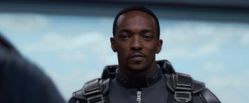Movie still from “Captain America: The Winter Soldier” (2014), directed by Anthony Russo – A person wearing a suit; Close Up shot, Low angle