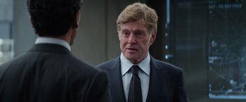 Movie still from “Captain America: The Winter Soldier” (2014), directed by Anthony Russo – A person wearing a suit and a tie; Close Up shot, Over the shoulder angle