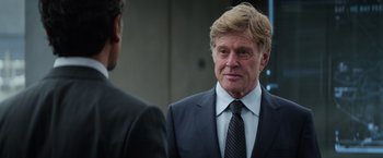 Movie still from “Captain America: The Winter Soldier” (2014), directed by Anthony Russo – A man wearing a suit and tie talking to another man; Close Up shot, Over the shoulder angle