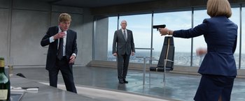 Movie still from “Captain America: The Winter Soldier” (2014), directed by Anthony Russo – A man in a suit and tie standing in front of a mirror; Medium shot, Over the shoulder angle