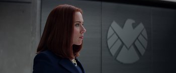 Movie still from “Captain America: The Winter Soldier” (2014), directed by Anthony Russo – A person wearing a suit; Close Up shot, Low angle