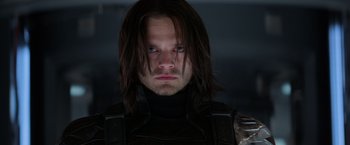 Movie still from “Captain America: The Winter Soldier” (2014), directed by Anthony Russo – A person with long dark hair; Close Up shot, Low angle