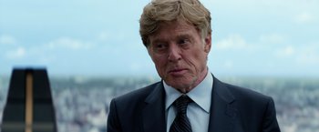 Movie still from “Captain America: The Winter Soldier” (2014), directed by Anthony Russo – A person wearing a suit and tie; Close Up shot, Low angle