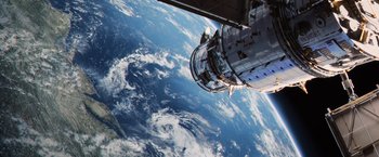 Movie still from “Captain America: The Winter Soldier” (2014), directed by Anthony Russo – A view of the earth from a space station window; Extreme Wide shot, Overhead angle
