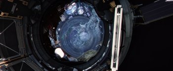 Movie still from “Captain America: The Winter Soldier” (2014), directed by Anthony Russo – A view of the earth from inside a space station; Extreme Wide shot, Overhead angle