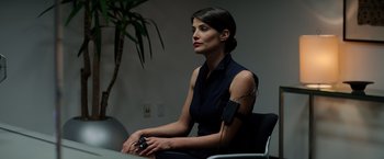 Movie still from “Captain America: The Winter Soldier” (2014), directed by Anthony Russo – A woman sitting in a chair with a cell phone in her hand; Close Up shot, Over the shoulder angle