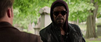 Movie still from “Captain America: The Winter Soldier” (2014), directed by Anthony Russo – A man wearing sunglasses and a black leather jacket; Close Up shot, Over the shoulder angle