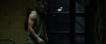 Movie still from “Captain America: The Winter Soldier” (2014), directed by Anthony Russo – A man with long curly hair is holding a pair of boxing gloves; Medium shot, Low angle