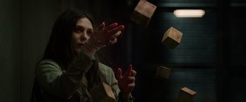 Movie still from “Captain America: The Winter Soldier” (2014), directed by Anthony Russo – A woman is throwing boxes in the air; Close Up shot, Low angle