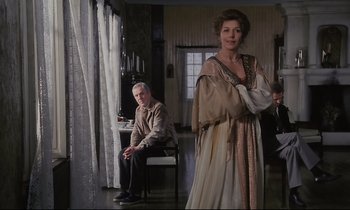 Movie still from “The Sacrifice” (1986), directed by Andrei Tarkovsky – A man and a woman dressed in medieval clothing; Medium shot, Over the shoulder angle