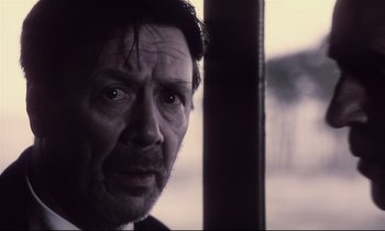 Movie still from “The Sacrifice” (1986), directed by Andrei Tarkovsky – A person looking at the camera; Close Up shot, Low angle