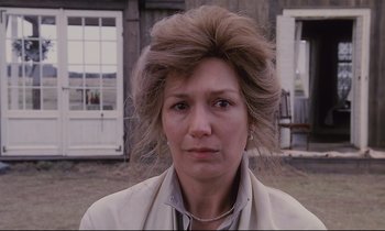 Movie still from “The Sacrifice” (1986), directed by Andrei Tarkovsky – A person wearing a jacket; Close Up shot, Low angle