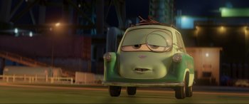 Movie still from “Cars 2” (2011), directed by John Lasseter – The face of a cartoon car; Medium shot, Low angle