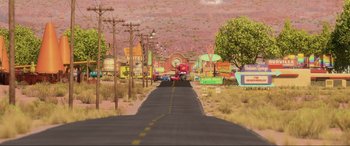 Movie still from “Cars 2” (2011), directed by John Lasseter – An image of an empty street in the middle of the desert; Extreme Wide shot, High angle