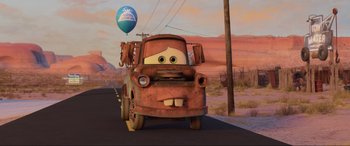Movie still from “Cars 2” (2011), directed by John Lasseter – Wide shot, Low angle