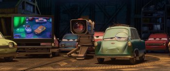 Movie still from “Cars 2” (2011), directed by John Lasseter – Wide shot, Low angle