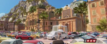Movie still from “Cars 2” (2011), directed by John Lasseter – An image of an animated city scene with cars; Extreme Wide shot, High angle