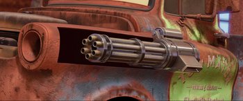 Movie still from “Cars 2” (2011), directed by John Lasseter – View of a gun that is attached to the side of a vehicle; Extreme Close Up shot, High angle