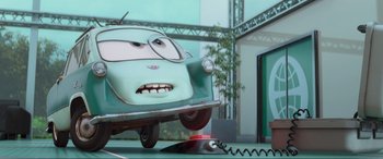Movie still from “Cars 2” (2011), directed by John Lasseter – A car with a face on the front of it; Wide shot, Low angle