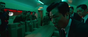 A group of men standing next to each other in a room