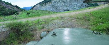 Movie still from “Carter” (2022), directed by Jung Byung-gil – A view of a mountain from a helicopter; Extreme Wide shot, High angle