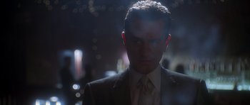 Movie still from “Casino” (1995), directed by Martin Scorsese – A person wearing a suit and tie; Close Up shot, Low angle