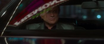 Movie still from “Casino” (1995), directed by Martin Scorsese – A man sitting in the back seat of a car; Close Up shot, Over the shoulder angle