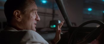 Movie still from “Casino” (1995), directed by Martin Scorsese – A man sitting in the driver's seat of a car; Close Up shot, Low angle