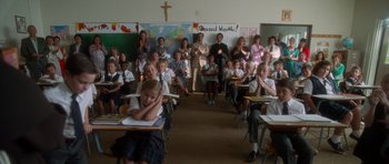 Movie still from “Casino” (1995), directed by Martin Scorsese – A group of children sitting at desks in a classroom; Wide shot, High angle