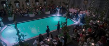Movie still from “Casino” (1995), directed by Martin Scorsese – A group of people standing around a swimming pool; Extreme Wide shot, High angle