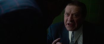 Movie still from “Casino” (1995), directed by Martin Scorsese – An older man in a suit and tie is talking to someone; Close Up shot, Over the shoulder angle
