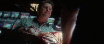 Movie still from “Casino” (1995), directed by Martin Scorsese – A man looking at a dead body in a room; Close Up shot, Over the shoulder angle