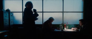 Movie still from “Casino” (1995), directed by Martin Scorsese – Two people sitting at a table in front of a window; Wide shot, Over the shoulder angle