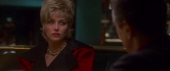 Movie still from “Casino” (1995), directed by Martin Scorsese – A woman sitting in front of another woman in front of a mirror; Close Up shot, Over the shoulder angle
