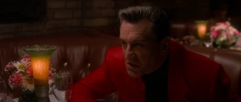 Movie still from “Casino” (1995), directed by Martin Scorsese – A person wearing a red jacket; Close Up shot, Over the shoulder angle